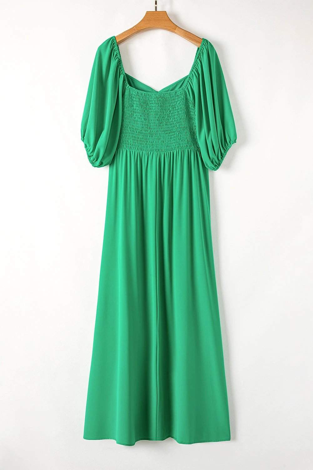 Bright green plus size maxi dress with ruched front and puff sleeves, long flowy silhouette.