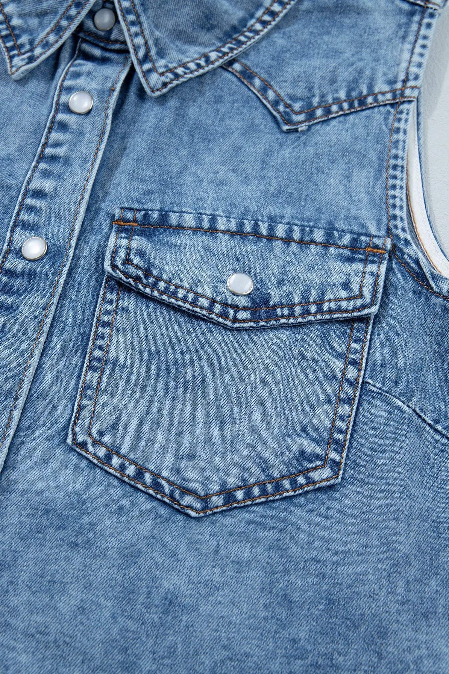 Sleeveless button-front collared denim top with Western Chic style and metallic snap closures