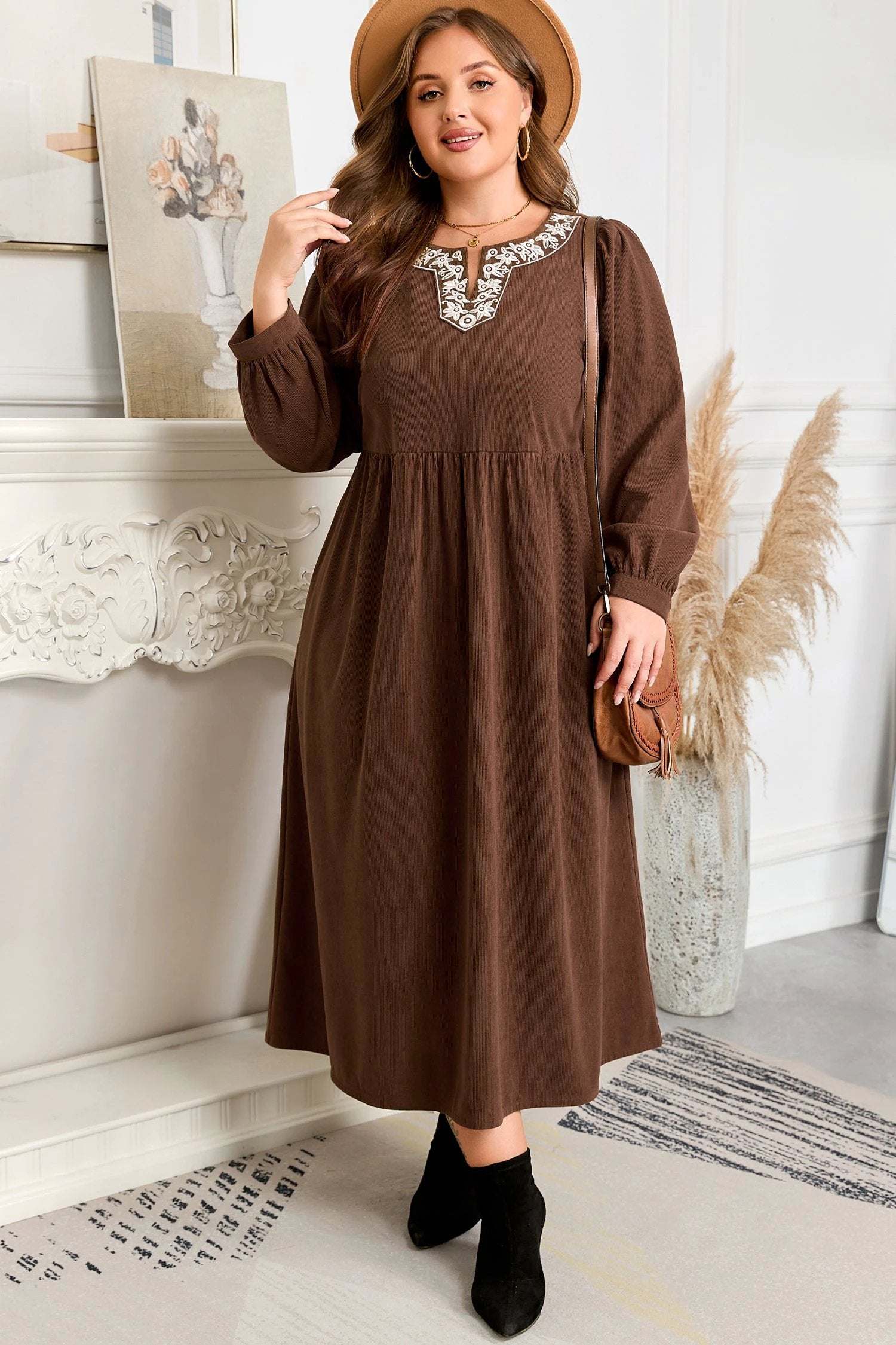 Plus size embroidered midi dress with notched neckline and long sleeves showcasing main character energy style.
