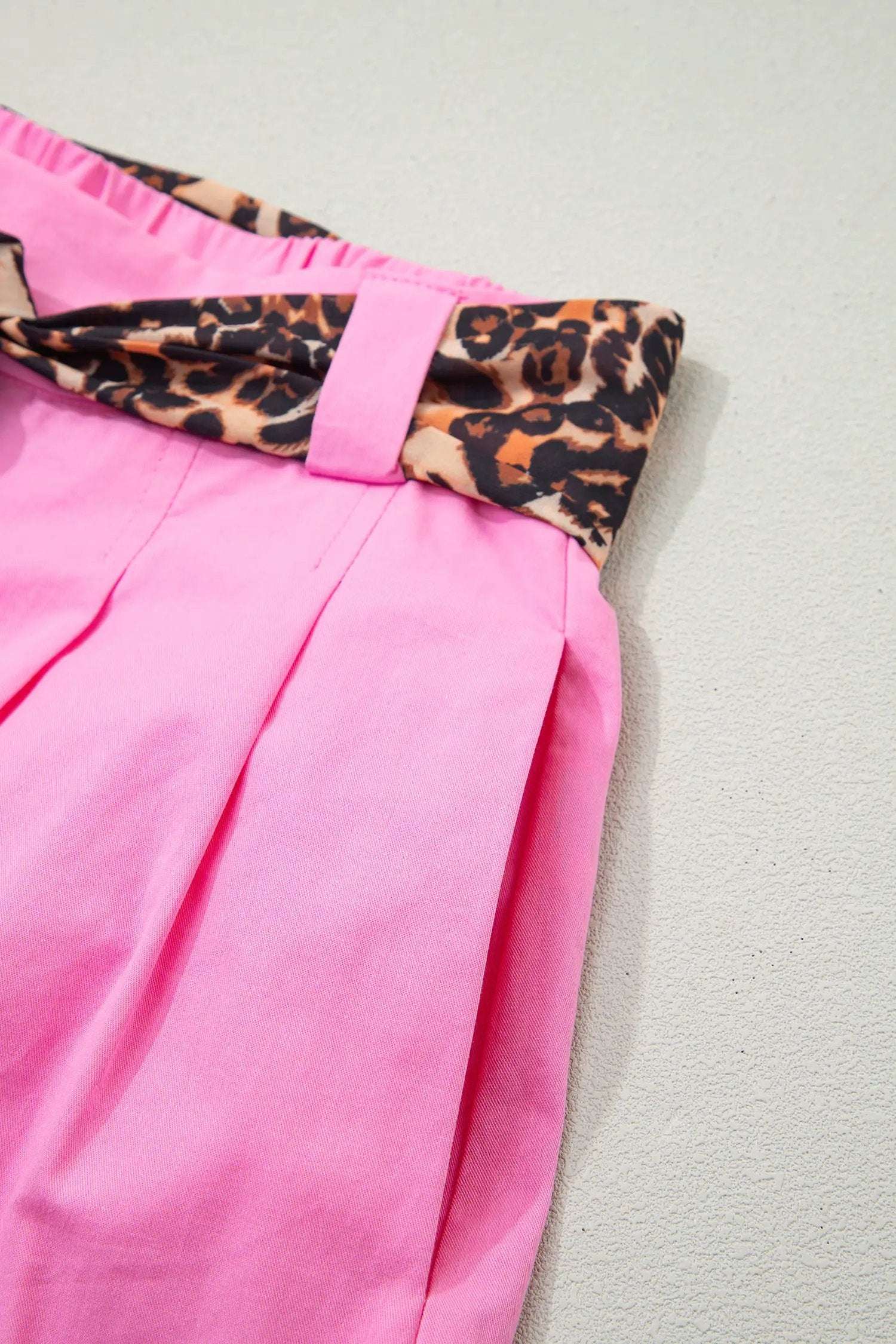Pink pleated wide leg shorts with leopard contrast sash belt for weekend vibe style