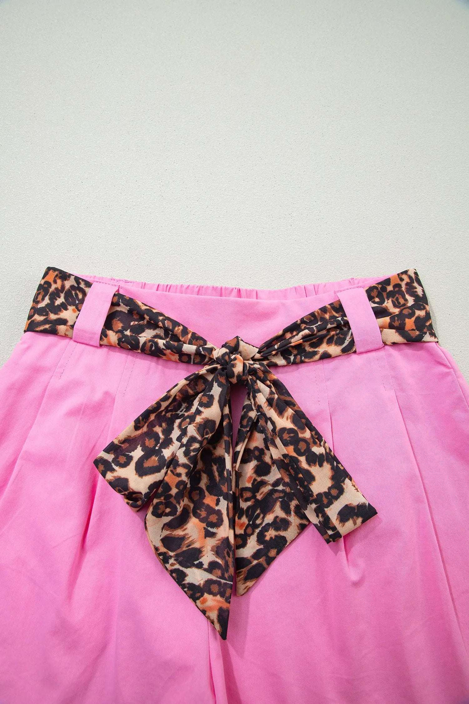 Pink pleated wide-leg shorts with leopard contrast sash belt styled for Weekend Vibe look