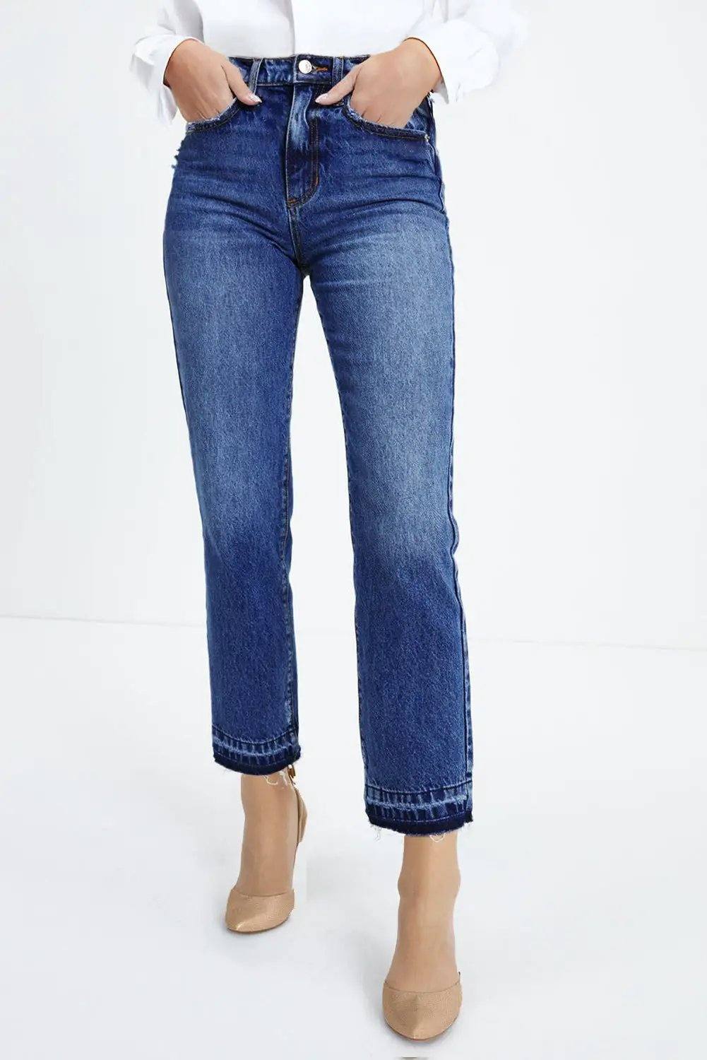 Whiskered wash cropped jeans with raw hem showcasing main character energy style