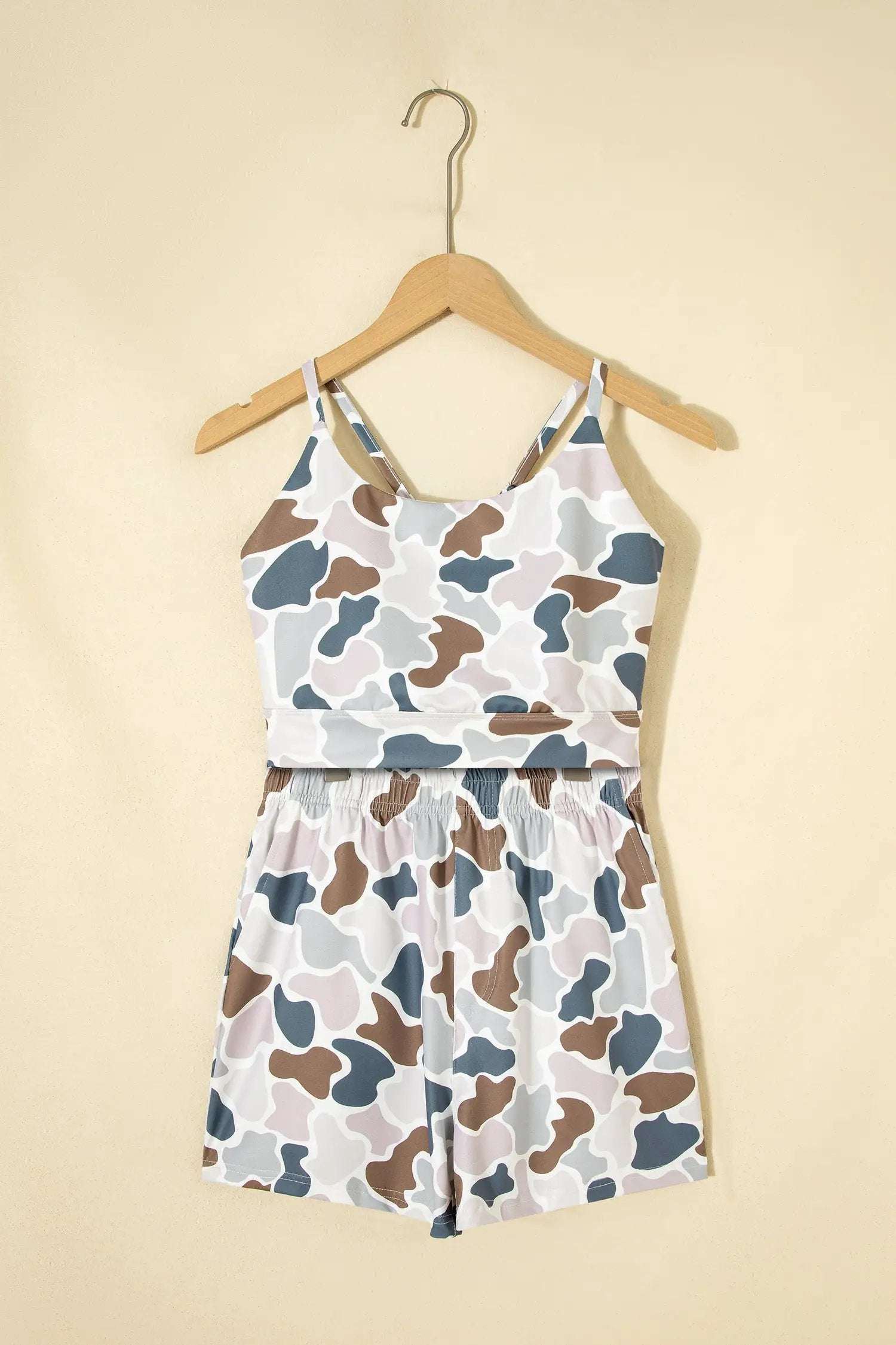 Woman wearing Cozy Confidence camouflage printed cropped tank and shorts two-piece outfit set