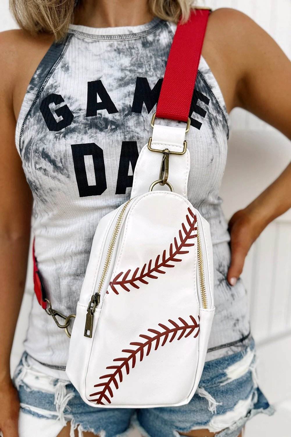 Mom Vibe sling bag in PU leather with baseball stitch and zipper closure, compact crossbody design for busy moms