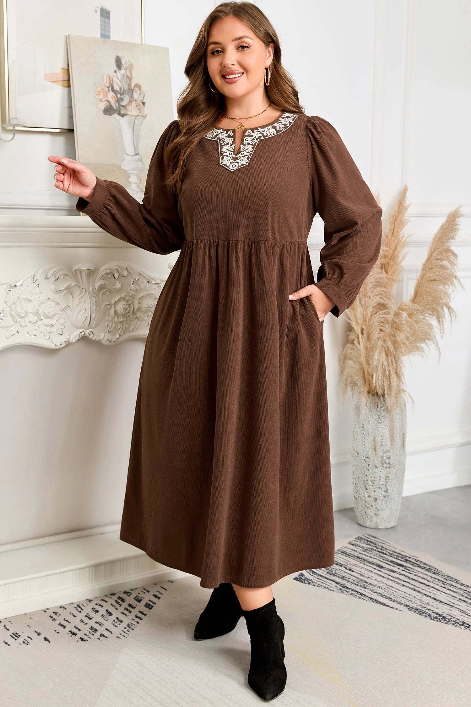Plus size embroidered notched-neck midi dress showcasing main character energy with elegant western-inspired details and flowing silhouette.
