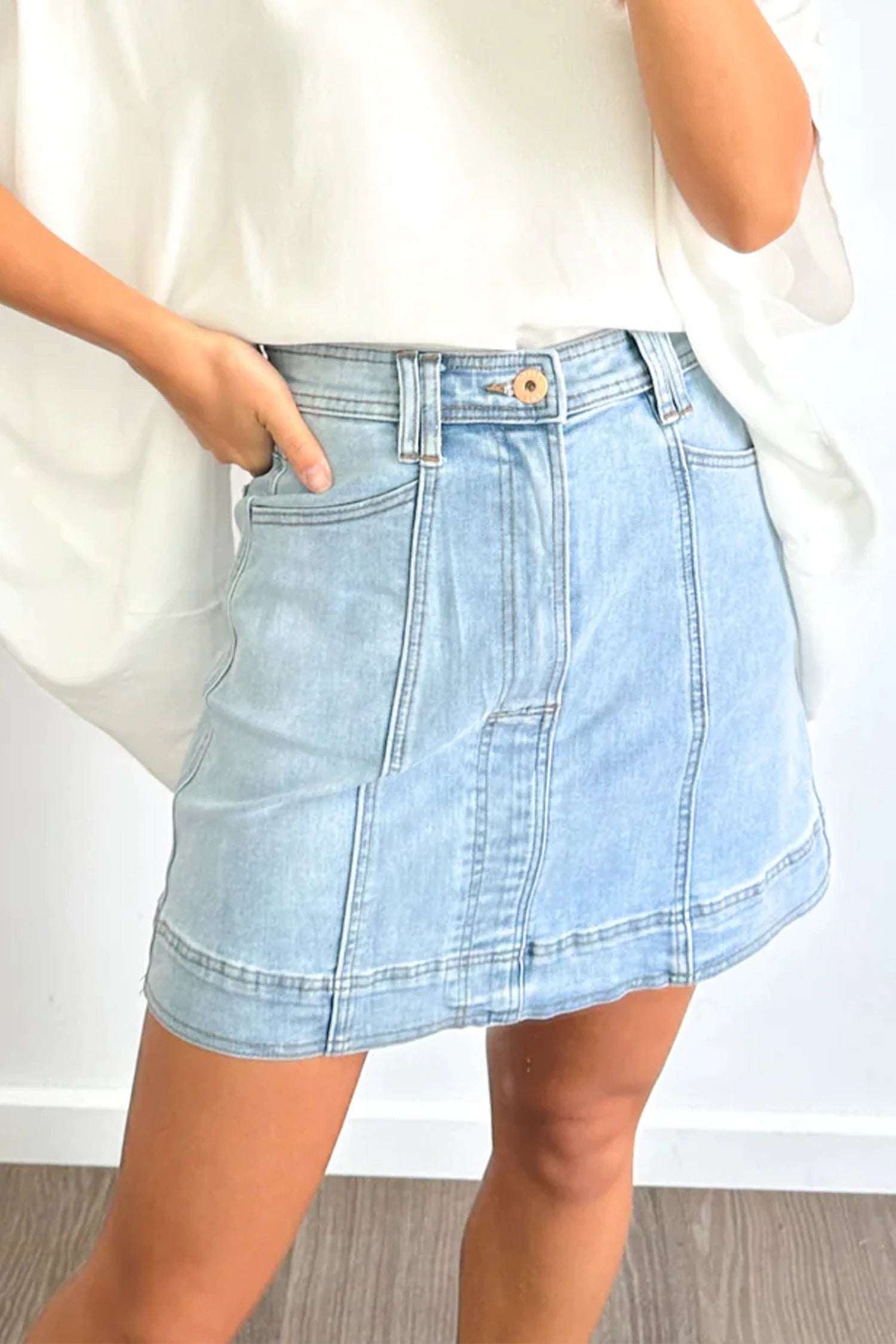 Soft Denim Blue exposed seam detail a-line denim mini skirt with pockets for women casual everyday outfit