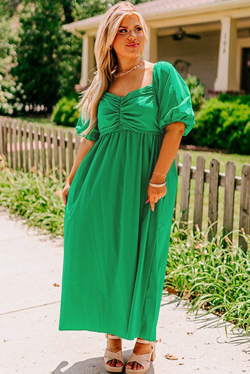 Plus size bright green ruched front maxi dress with puff sleeves and flowy A-line silhouette