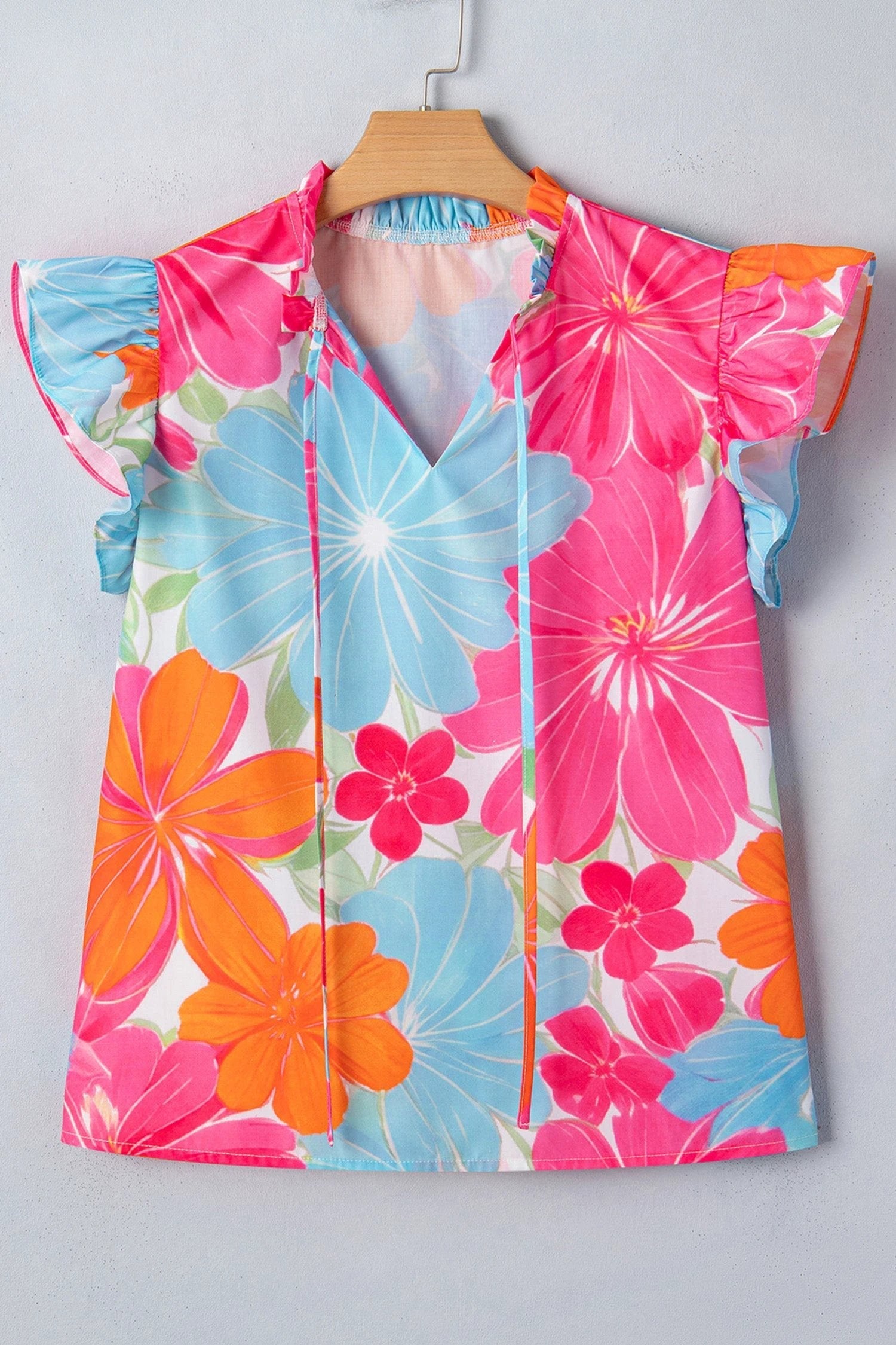 Multicolor vibrant floral tie-neck sleeveless blouse with ruffle trim