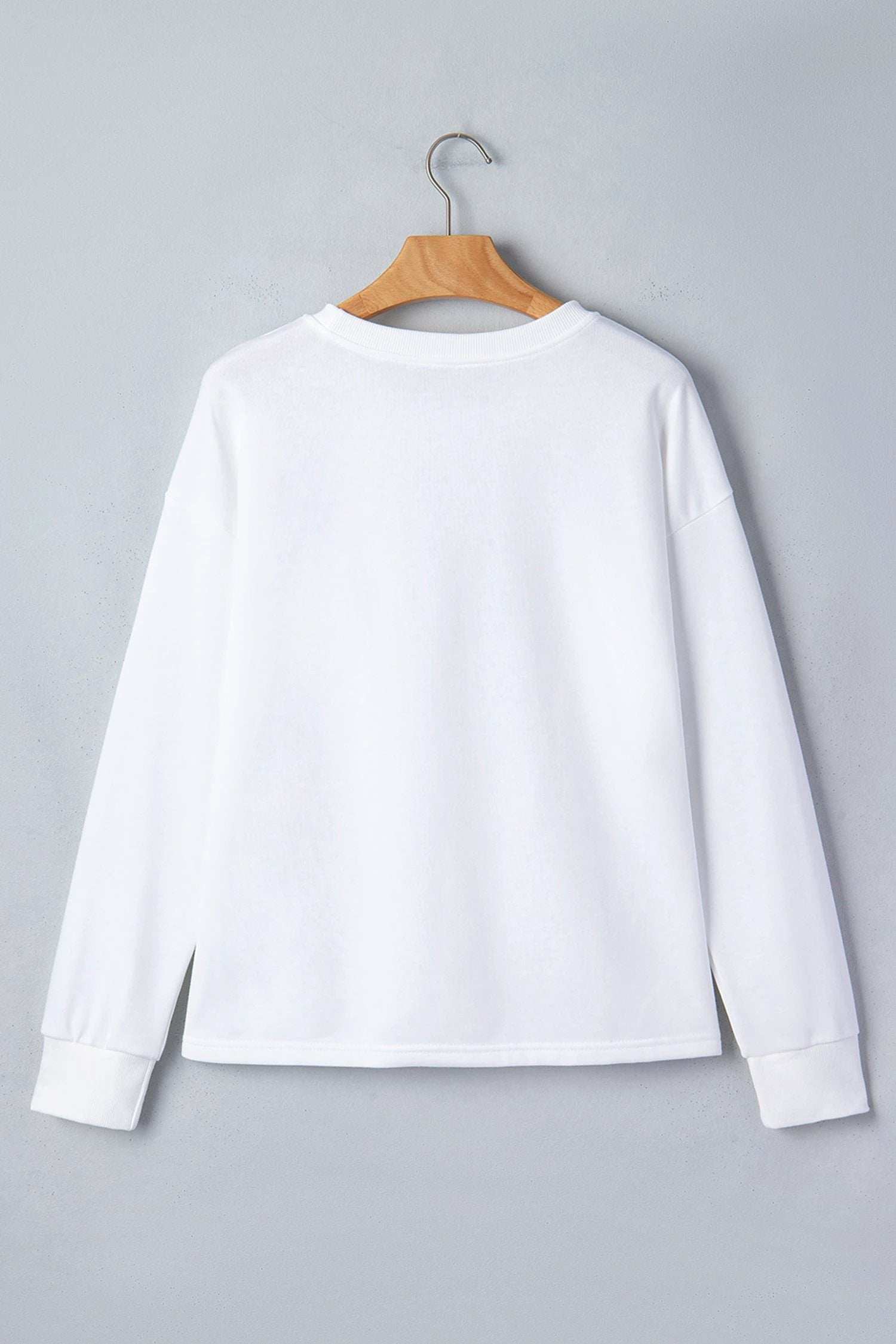 white solid color dropped shoulder long sleeve top for women casual everyday outfit