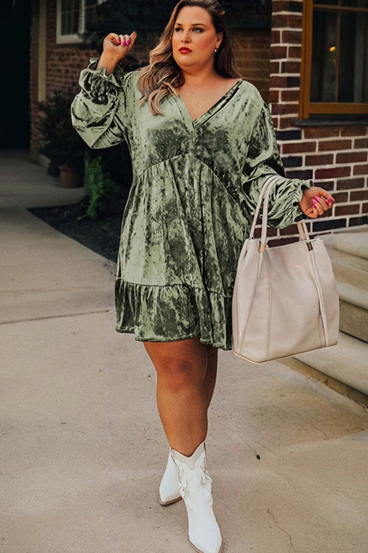 Plus size velvet babydoll mini dress with puff sleeves in emerald green