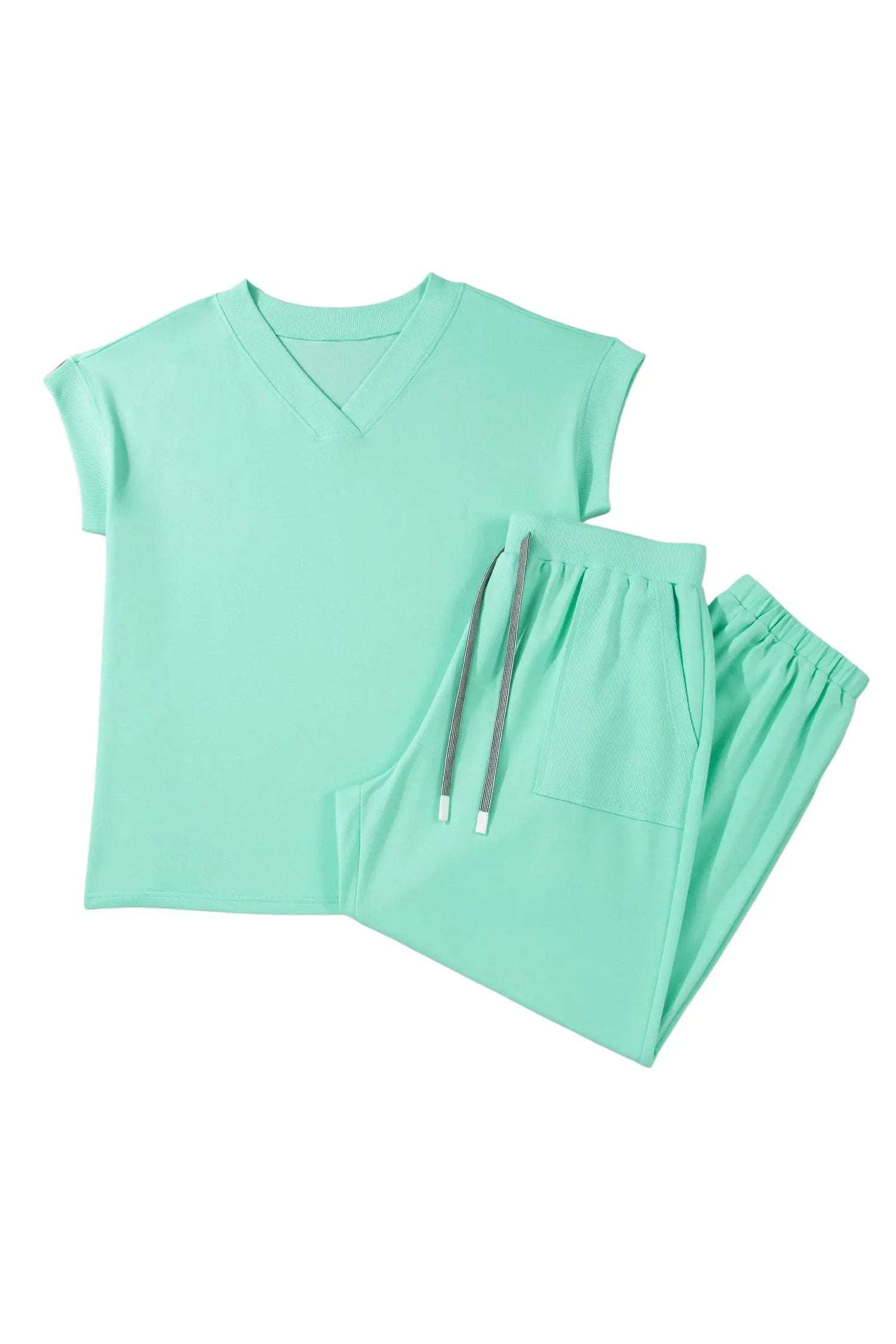 Plus size woman wearing a relaxed V-neck tee and drawstring pants outfit set for comfortable casual wear