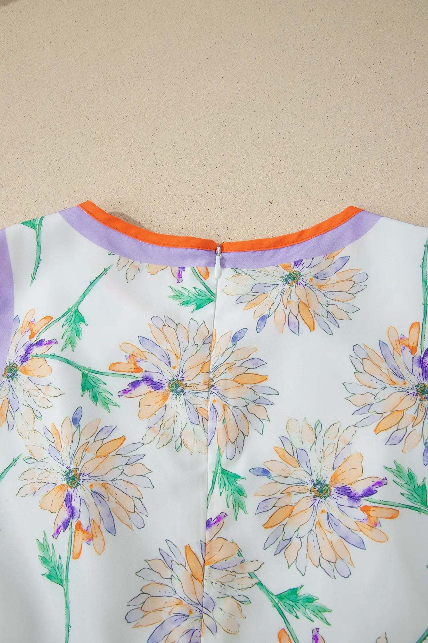 White floral print maxi dress with belted waist and color-block trim