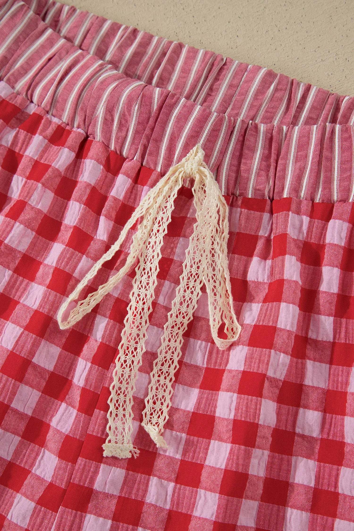 Gingham ruffle hem shorts with lace tie details in lightweight fabric for casual weekend style