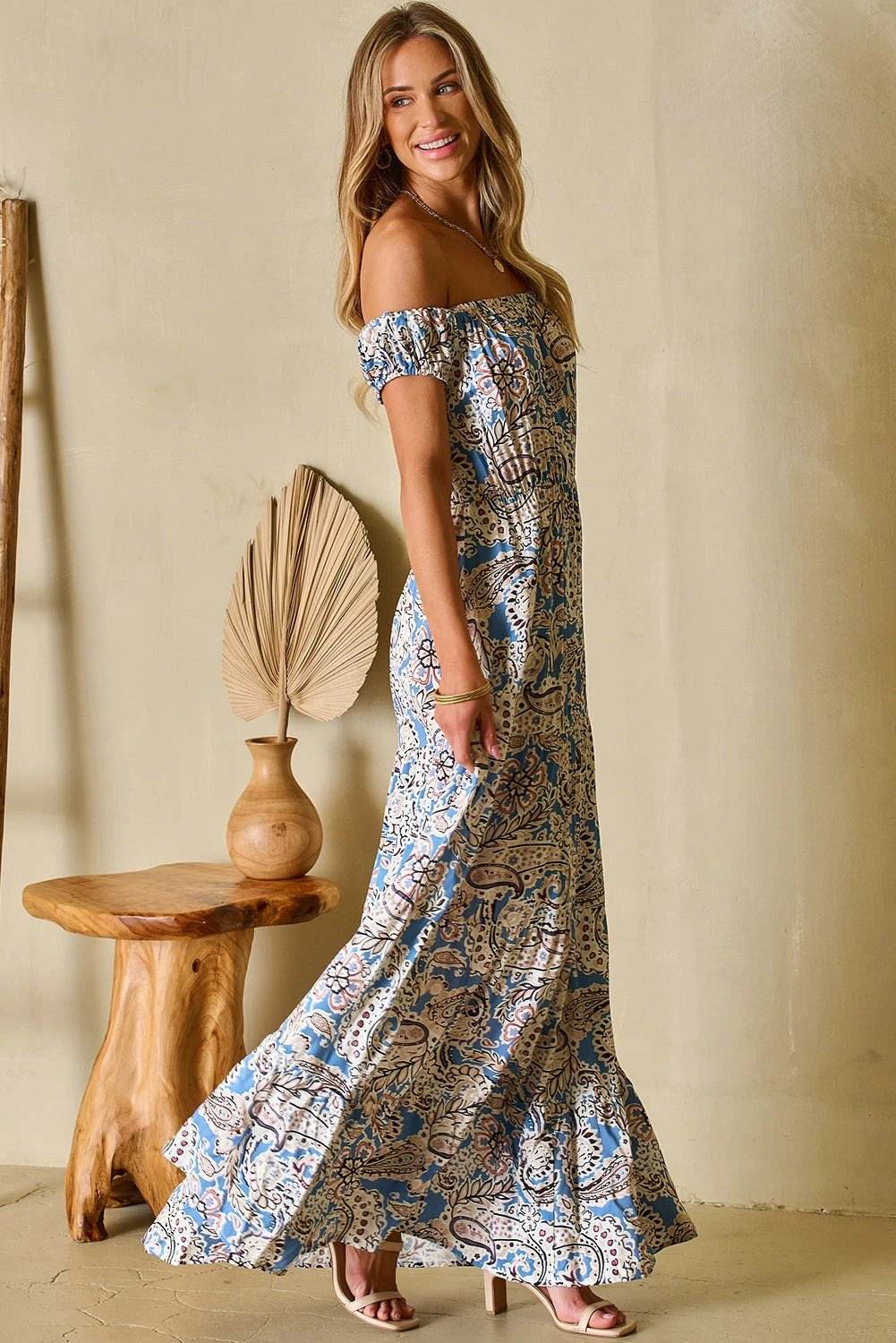 Woman wearing Boho Goddess off shoulder paisley floral print maxi dress outdoors