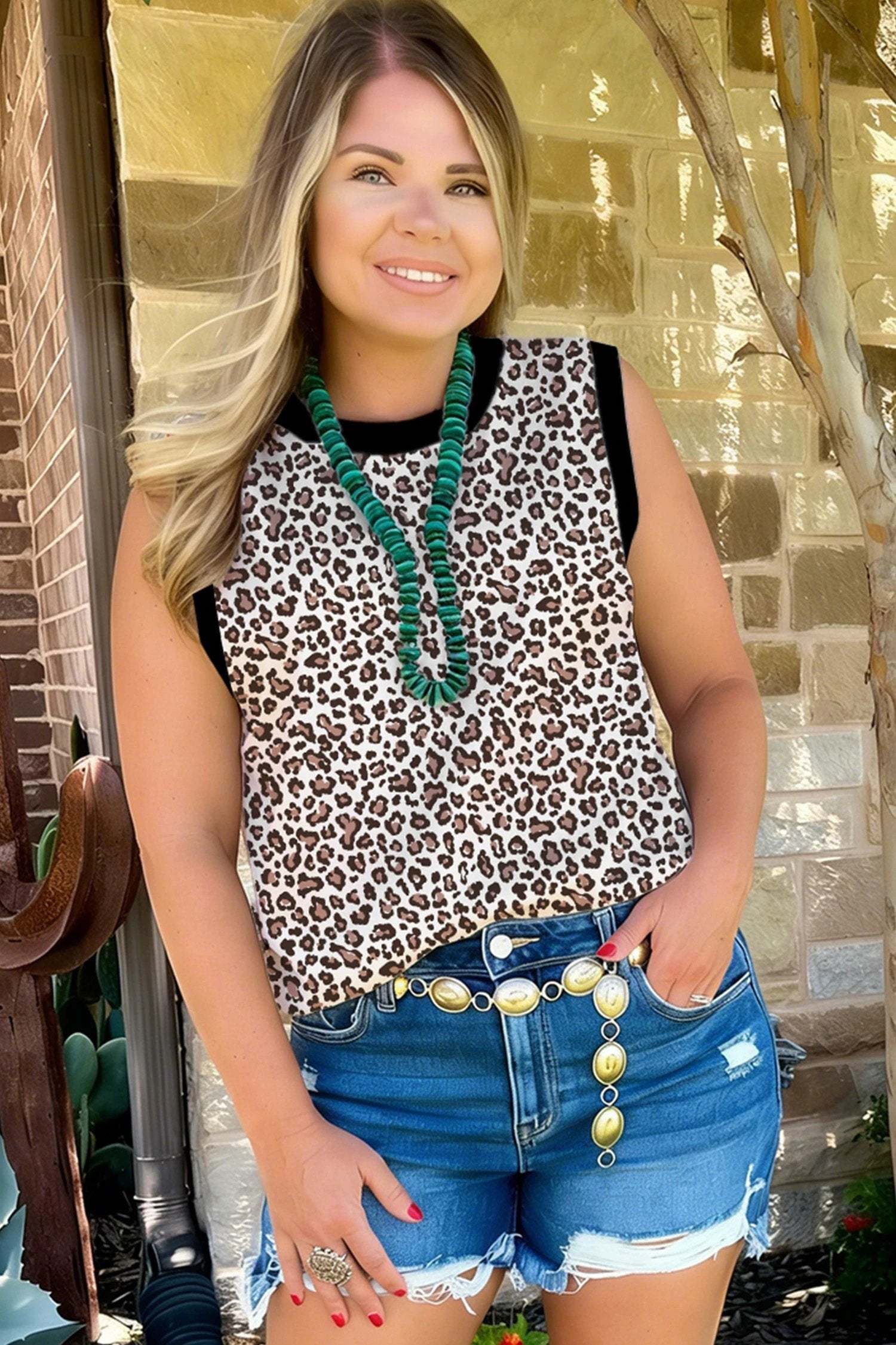 Plus size leopard top sleeveless with khaki trim on plus size model