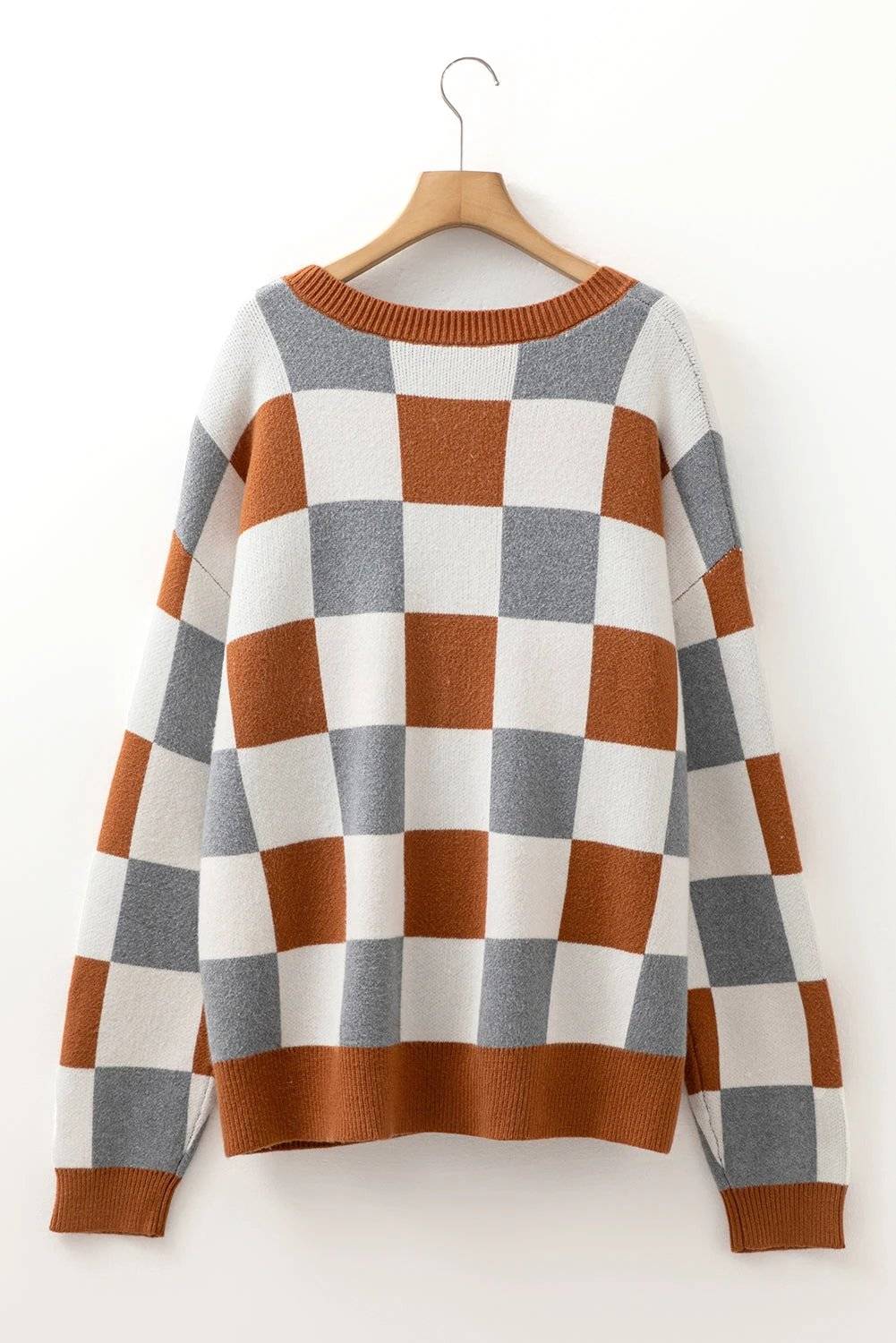 Plus size checkered crewneck sweater in brown, white, and gray with ribbed cuffs and relaxed fit