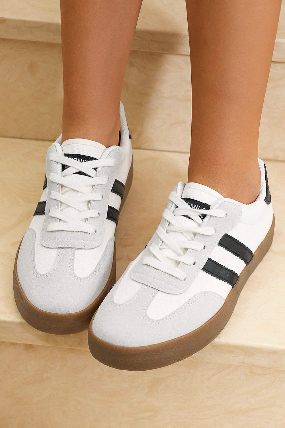 White striped lace-up flat sneakers with gum outsole for chic mom energy and everyday comfort