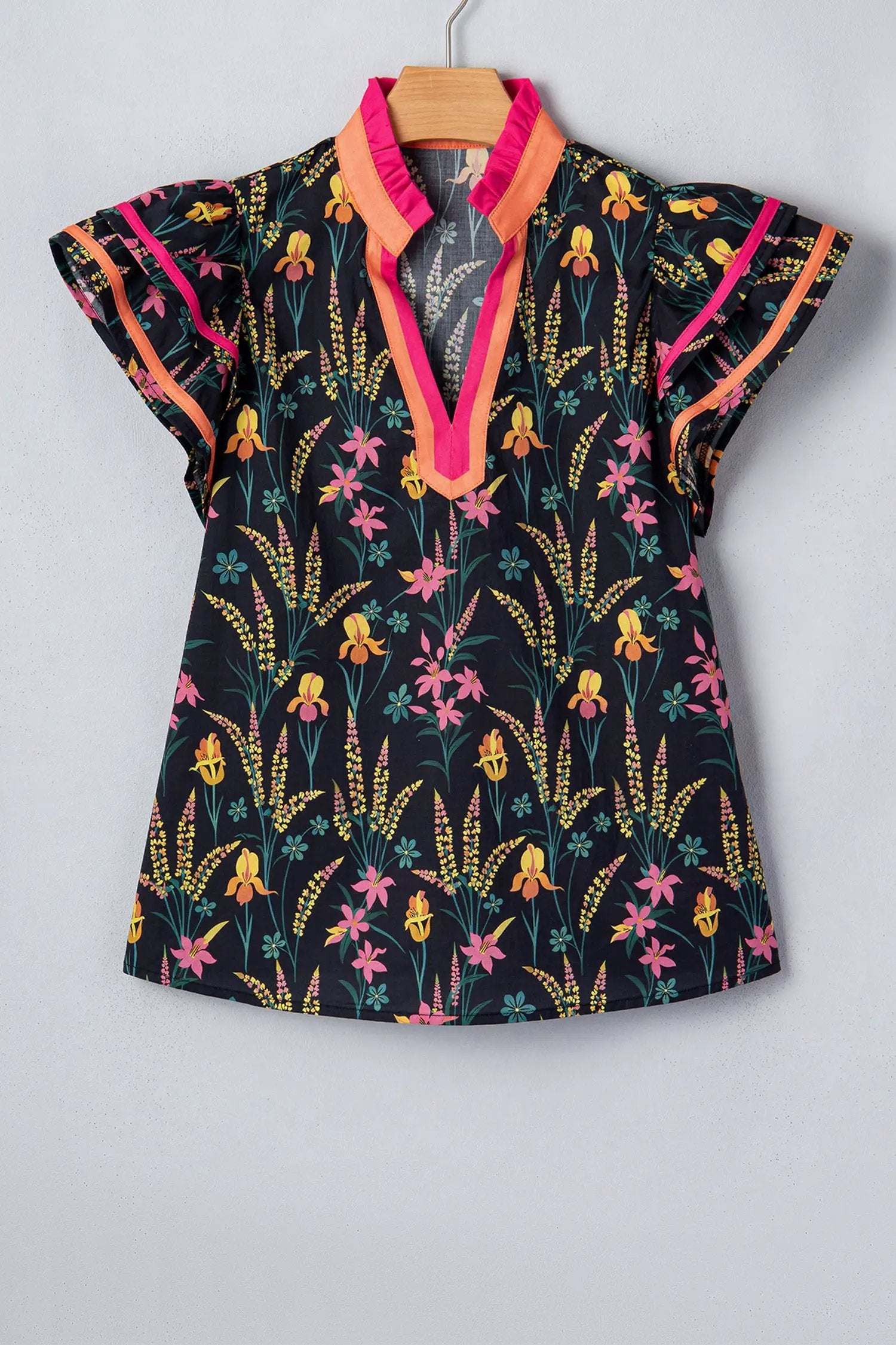 Black floral print tiered blouse with short flutter sleeves and contrast trim