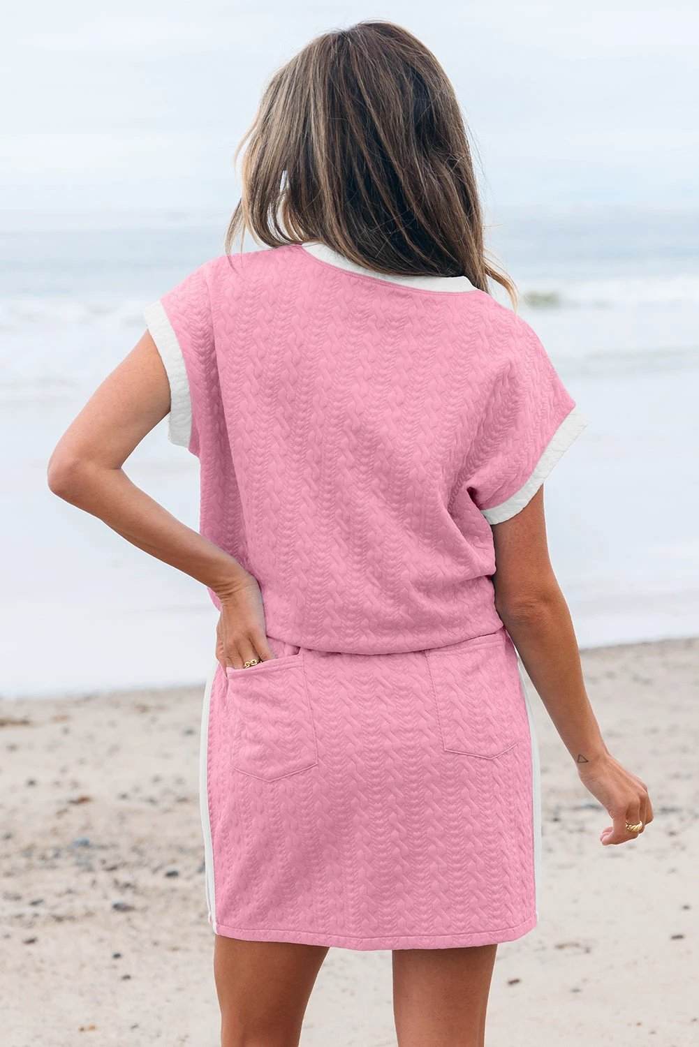 Blue textured crewneck tee with white trim and pocketed contrast skirt set outfit
