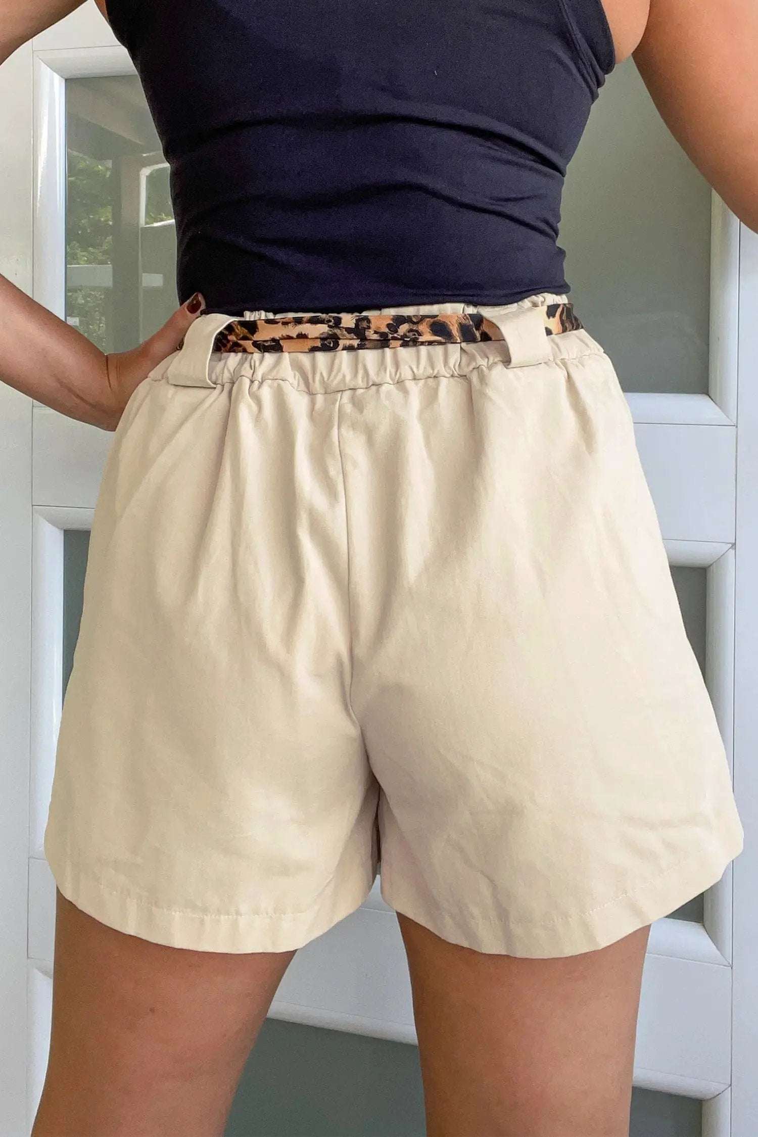 Pink pleated wide leg shorts with leopard contrast sash belt for Weekend Vibe style