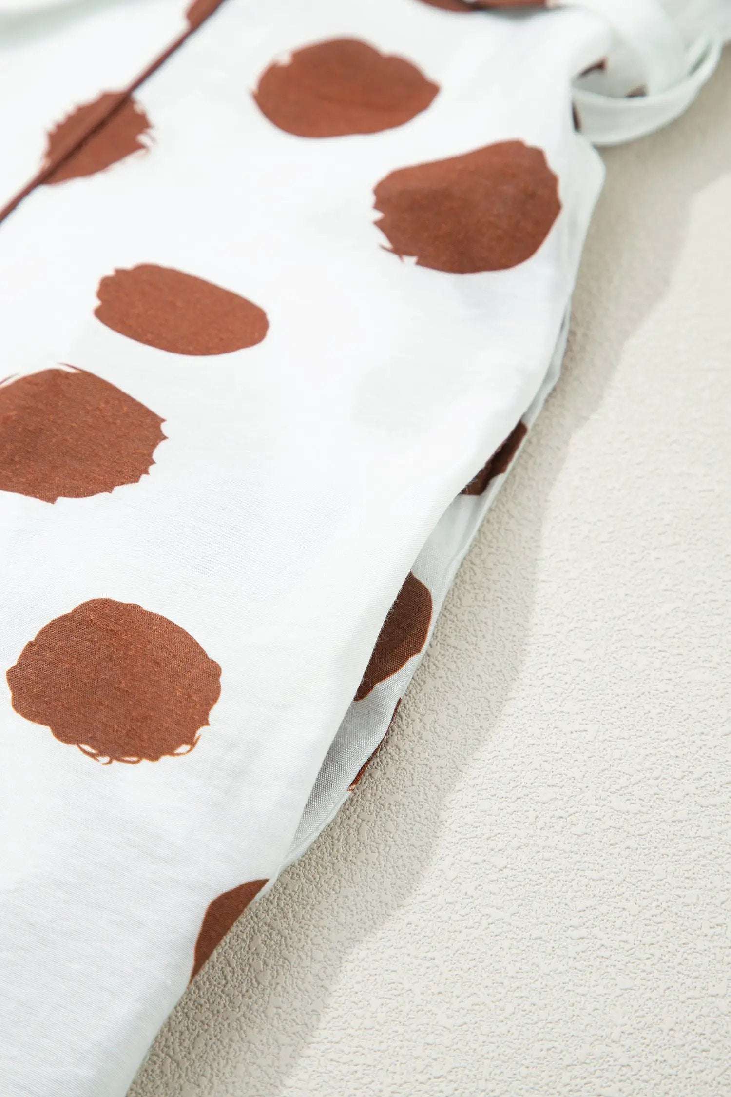 White midi dress with chocolate brown polka dots, V neck, short sleeves, and tie waist Polka Dot Daydream style