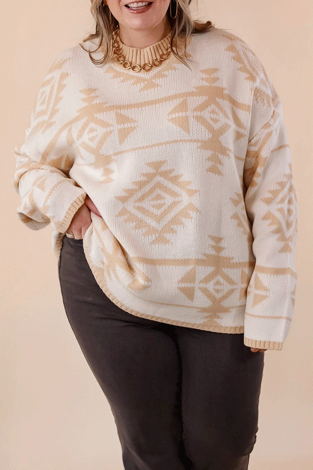 Plus size relaxed knit sweater with Western Aztec print in warm neutrals.