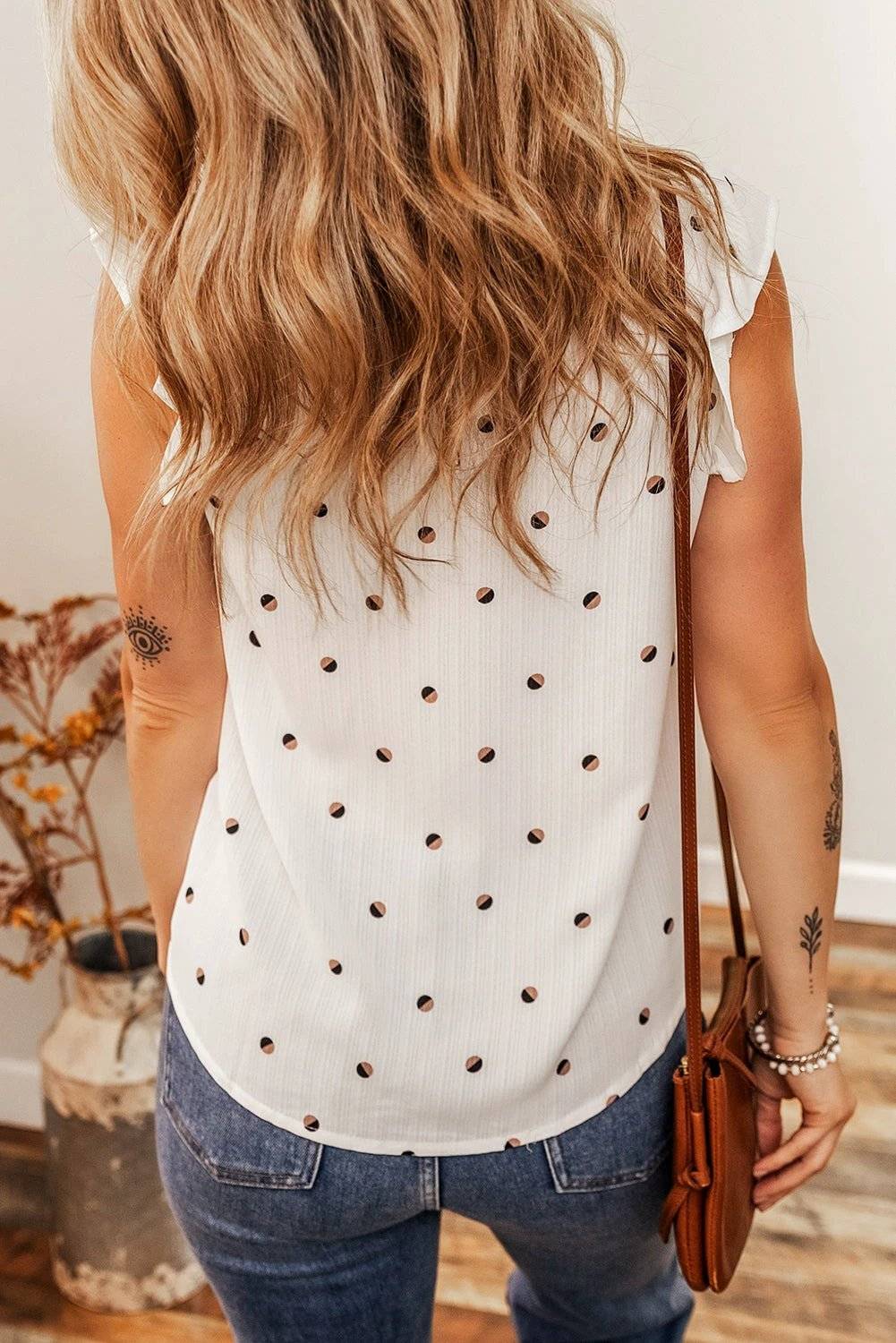 Lightweight Polka Dot Day Dream V-neck tank top with ruffled shoulders and breathable fabric