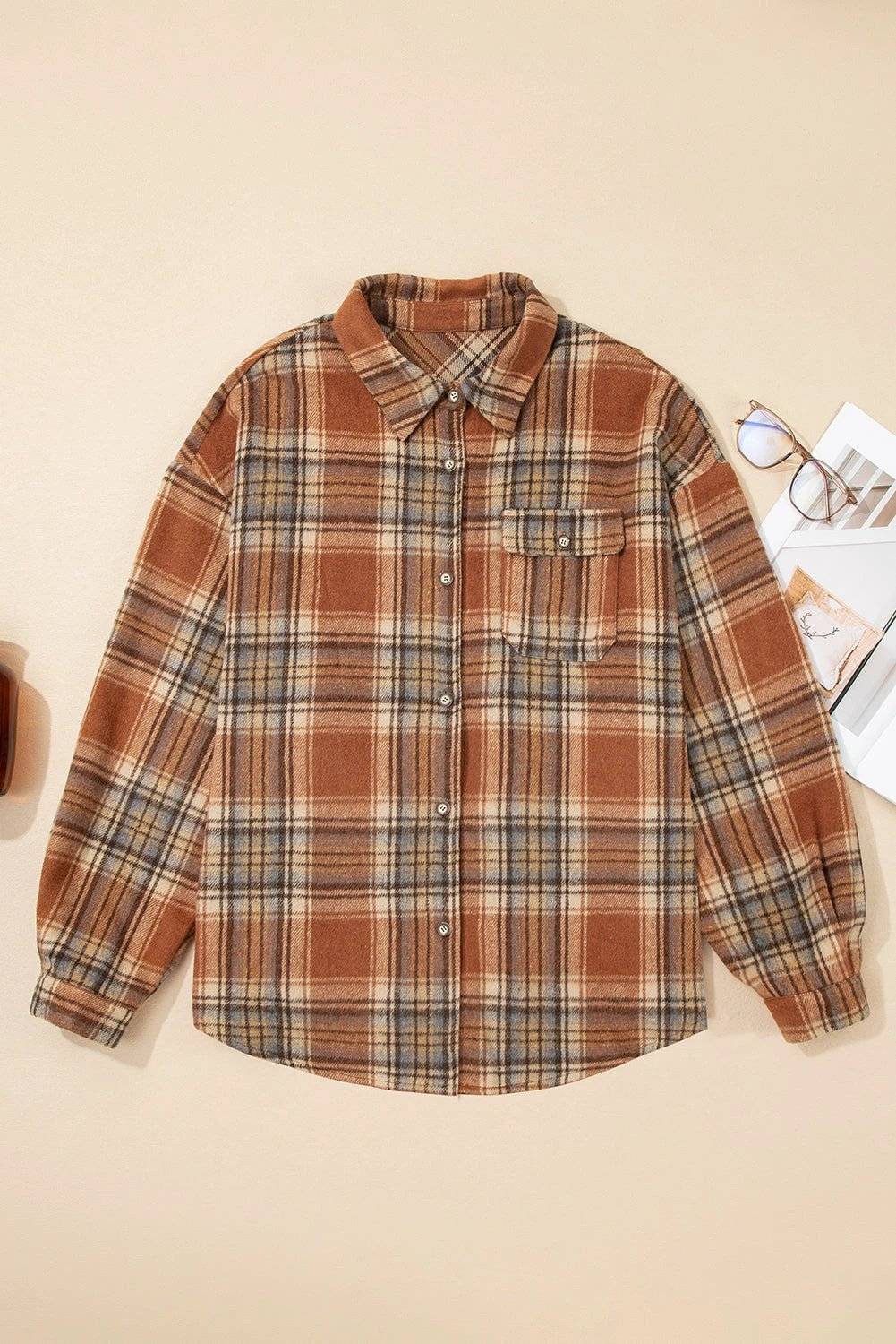 Plus size plaid western shacket with flap pockets and button closure in neutral tones