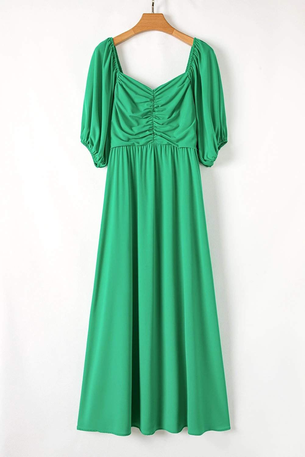 Plus size bright green ruched front maxi dress with puff sleeves and flowy silhouette