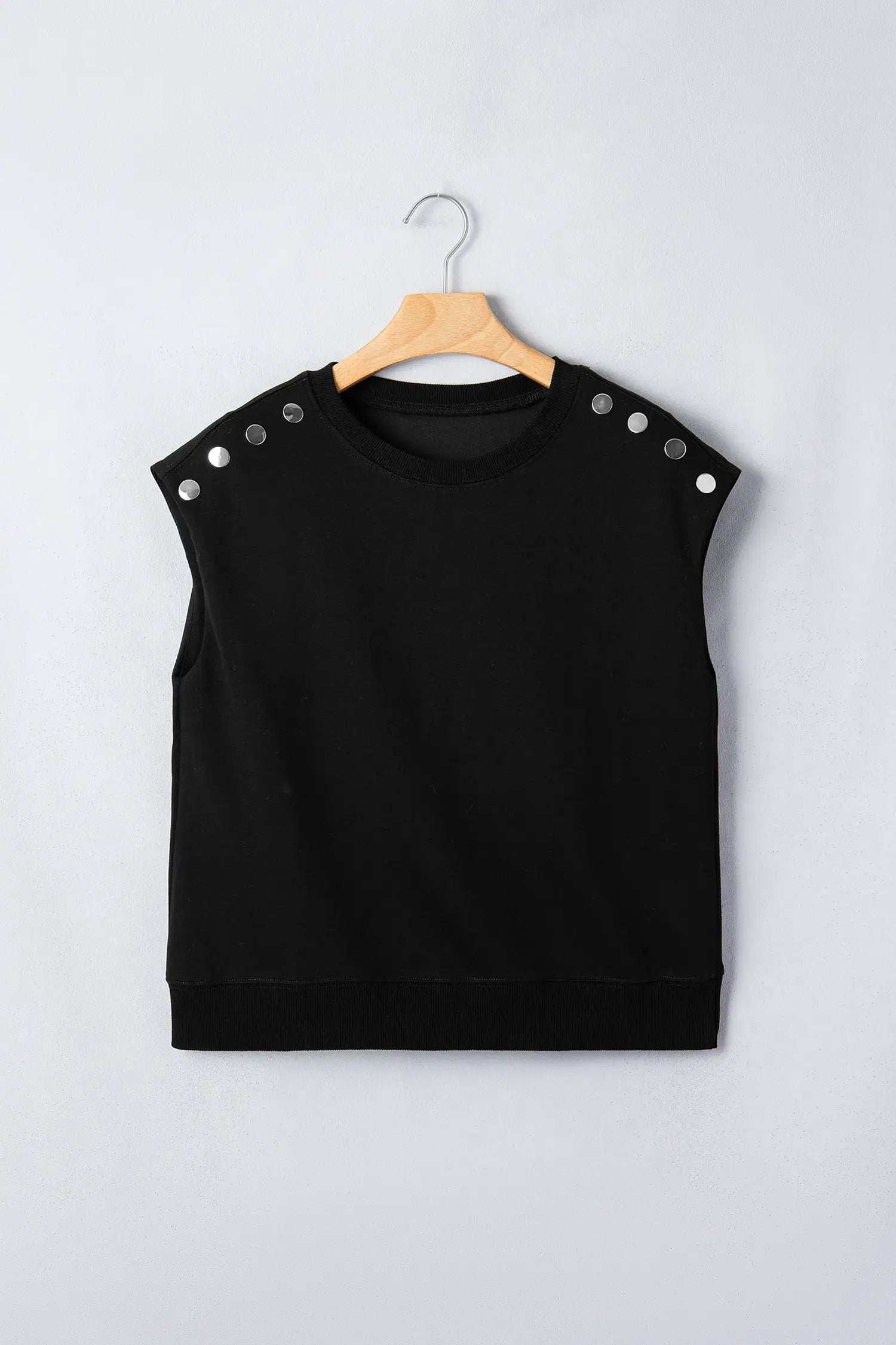 Black short sleeve top with metal button details for effortless chic mom style
